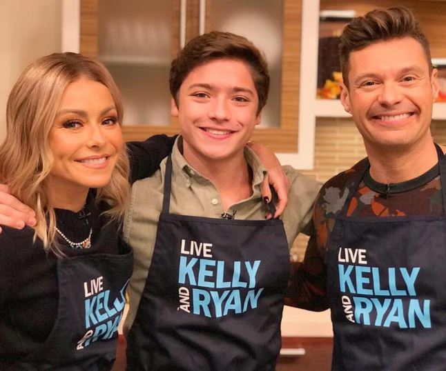 Joaquin Antonio Consuelos with his mother, Kelly Ripa and Her fellow host, Ryan Seacrest on an American talk show, Live With Kelly And Ryan.